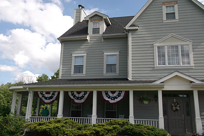 Photo of the main entrance and front porch of the White Garden inn